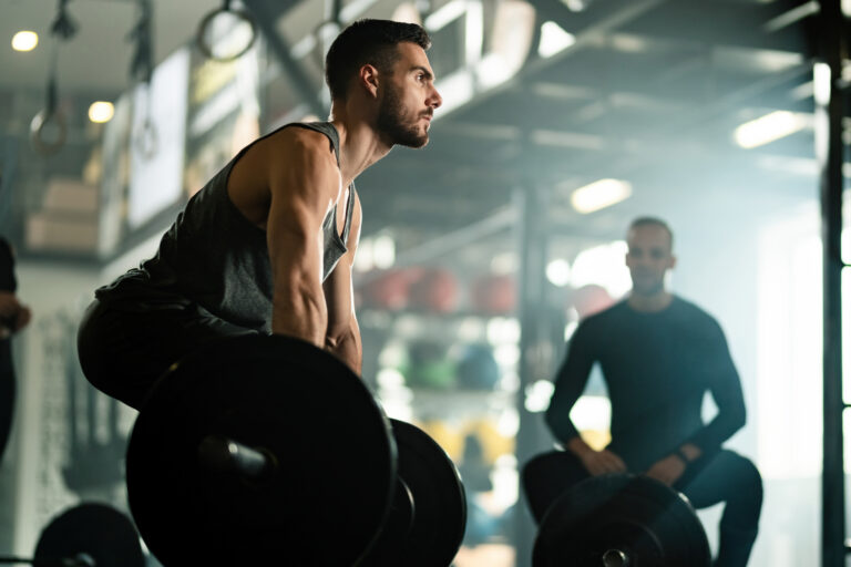 Man drinking black coffee before morning gym routine workout session
